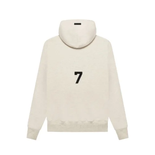 A white hoodie featuring the word "Essentials" prominently displayed on the front.