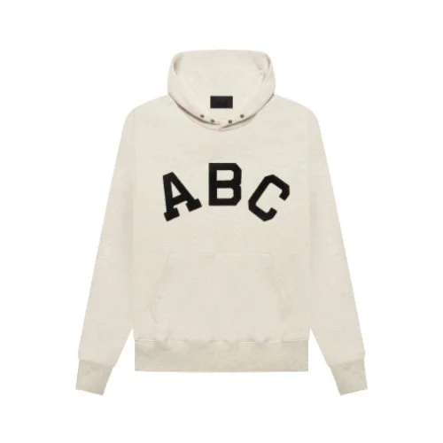 White Fear of God Essentials ABC Hoodie displayed on a plain background.