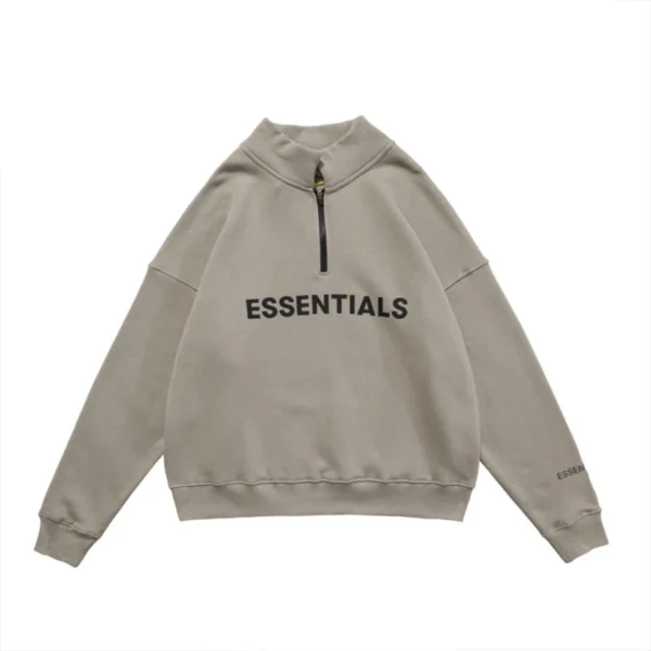 Essentials Half Zip High Collar Hoodie in a loose fit, showcasing the word "Essentials" on the chest area.