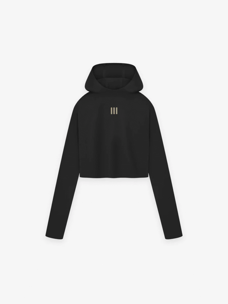 Women's cropped hoodie with a prominent gold logo from Fear of GOD Essentials, ideal for layering and casual wear