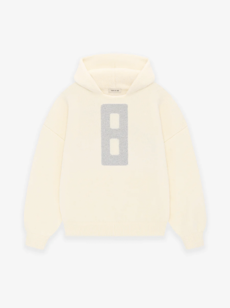 A white Fear of God Essentials hoodie featuring the number 8 prominently displayed on the front.